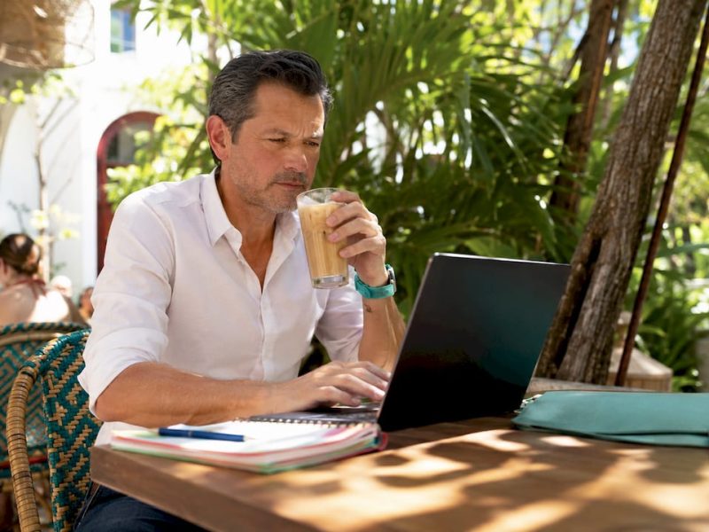 Man browsing hotel discounts on laptop