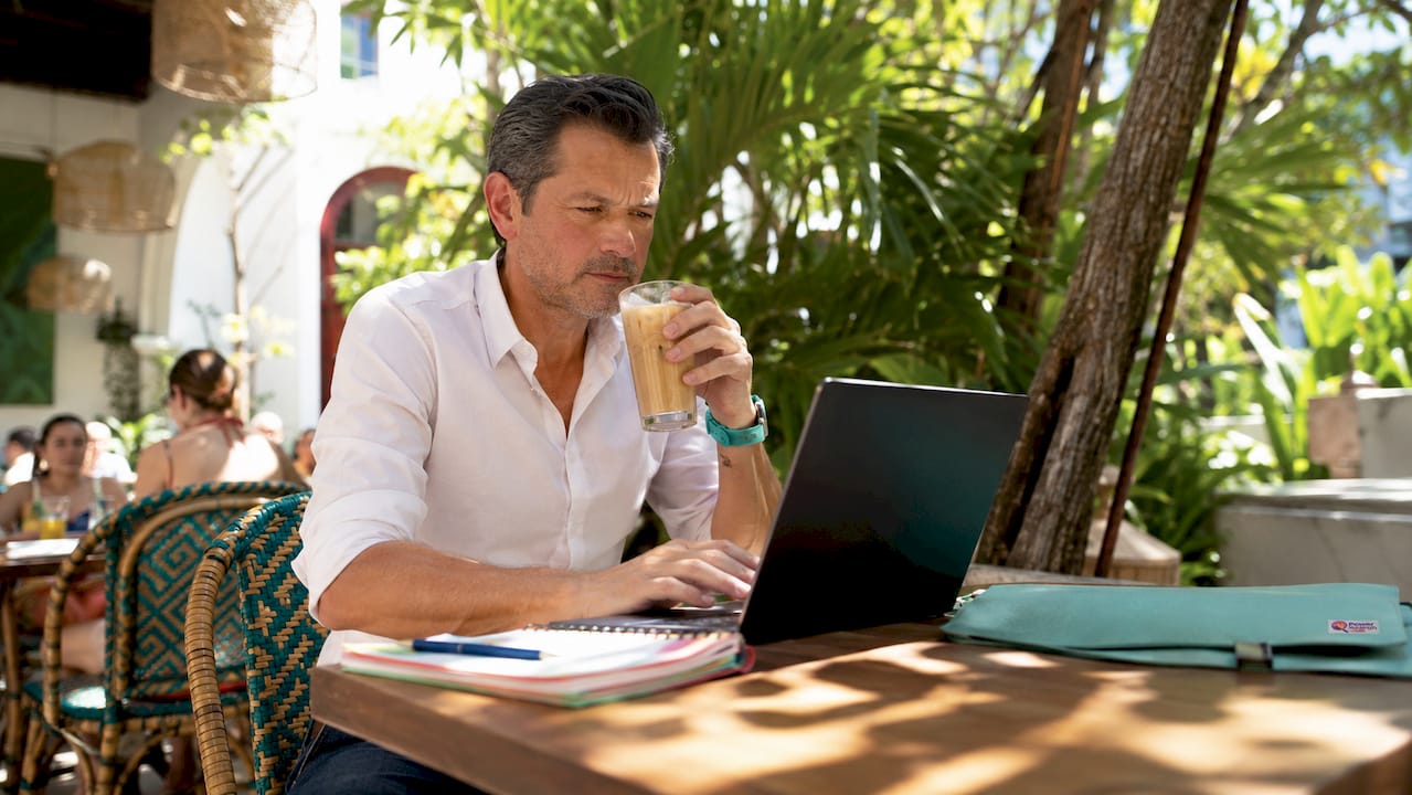 Man browsing hotel discounts on laptop